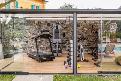 an outdoor gym with a glass wall and a gym at Villa Vitali - Bellagio in Bellagio