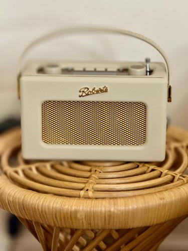 a radio sitting on top of a wicker basket at Hotel de Silhouette in Biarritz