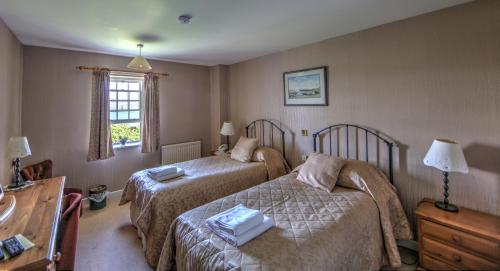 Кровать или кровати в номере Busta House Hotel