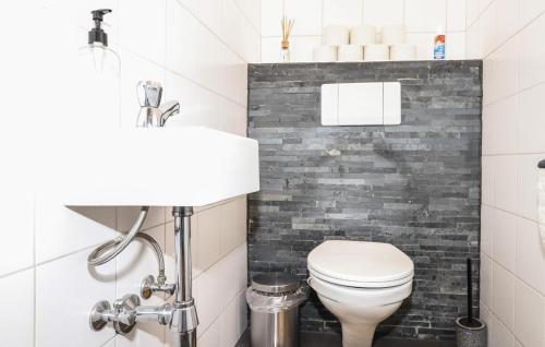 a bathroom with a toilet and a sink at Ferienwohnung In Bludenz in Bludenz