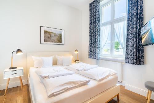 Postel nebo postele na pokoji v ubytování Villa am Strand