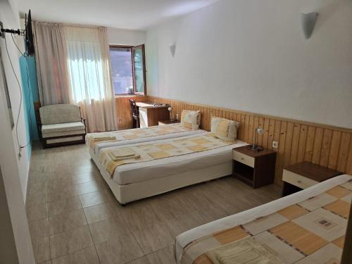 Katil atau katil-katil dalam bilik di Family Hotel Primo