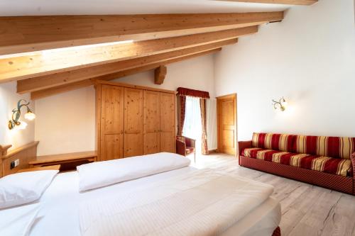 Posteľ alebo postele v izbe v ubytovaní Hotel Laurin