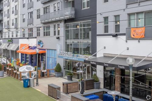 a view of a building with a courtyard in front at CozySuites at the Banks gym pool 07 in Cincinnati