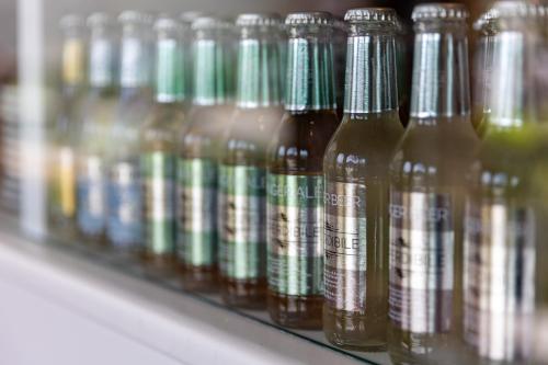 a row of glass bottles sitting on a shelf at Villa Vitali - Bellagio in Bellagio