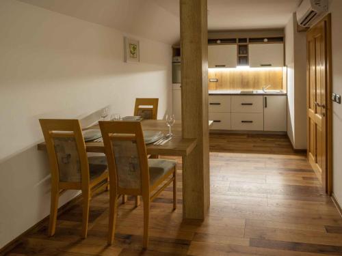 a kitchen and dining room with a table and chairs at Holiday home in Trebelno - Dolenjska & Bela krajina Unter- & Weißkrain 26032 in Trebelno
