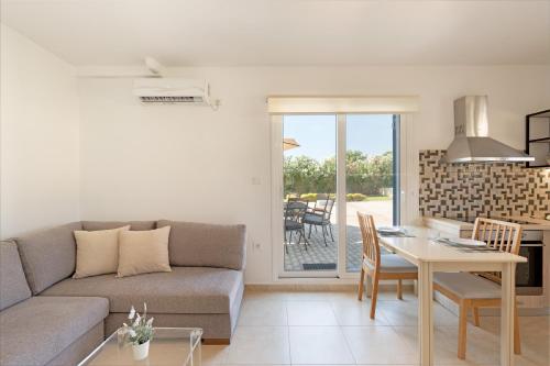 a living room with a couch and a table at Sandoa Residence - Lualaba & Tenke in Minia