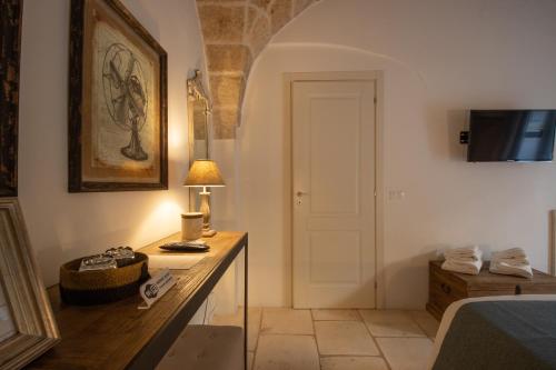 Masseriola Antiche Fogge by Apulia Hospitalityにあるテレビまたはエンターテインメントセンター