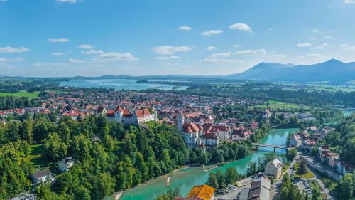 an aerial view of a city and a river at Ziegelberg Chalets in Füssen