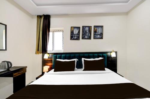 Postel nebo postele na pokoji v ubytování FabHotel O PNR Continental