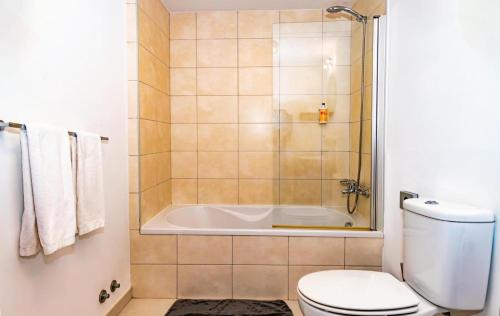 a bathroom with a shower and a toilet and a tub at HostySpot - Melia Dunas in Santa Maria