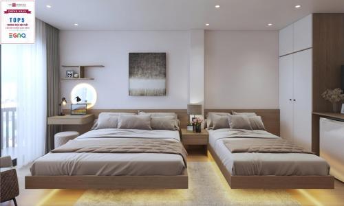 Voodi või voodid majutusasutuse Le Petit Hotel & Travel toas