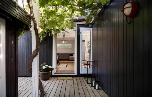 an open door to a deck with a house at Awesome Home In Ølsted With Wifi in Ølsted