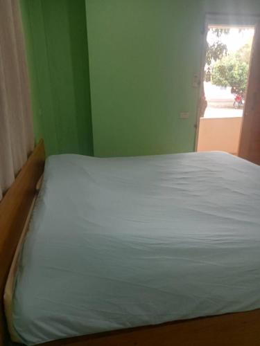 Postel nebo postele na pokoji v ubytování Baanmo Resort บ้านหมอรีสอร์ต