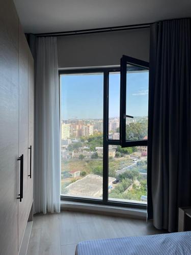 Ένα ή περισσότερα κρεβάτια σε δωμάτιο στο Emera Apartments