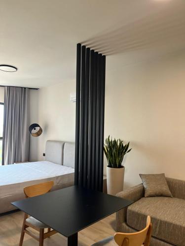 Ένα ή περισσότερα κρεβάτια σε δωμάτιο στο Emera Apartments
