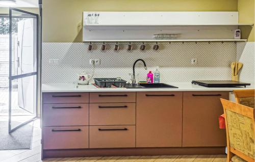 a kitchen with a sink and a counter top at Gorgeous Home In Boruja in Boruja