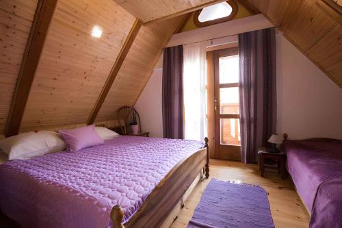 a bedroom with a large bed in a attic at Holiday home in Golik - Gorski Kotar 14249 in Zagolik