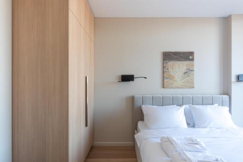 Postel nebo postele na pokoji v ubytování Aparthotel Nemunas