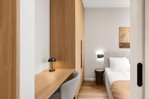 Postel nebo postele na pokoji v ubytování Aparthotel Nemunas