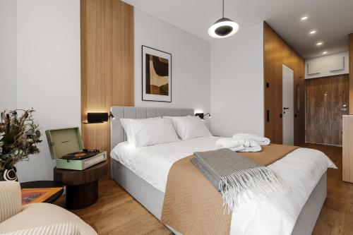 Postel nebo postele na pokoji v ubytování Aparthotel Nemunas