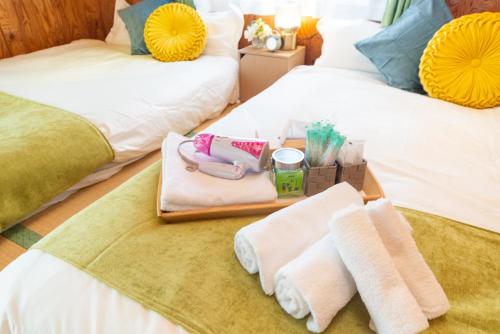 Una cama o camas en una habitación de すはらシーサイドハウス和歌山