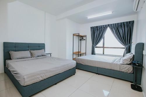 Postel nebo postele na pokoji v ubytování Ipoh Manhattan Premium Suites by Verve