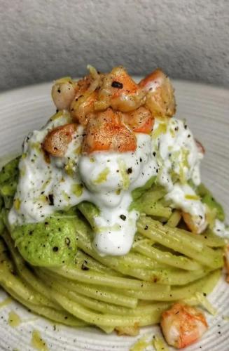 a plate of food with pasta and shrimp on top at Borbon Home luxury rooms & SPA in Palermo