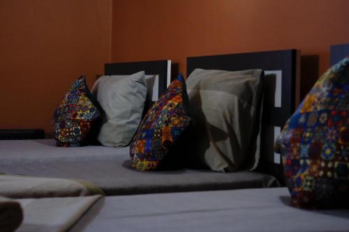 three pillows sitting on two beds in a room at Langa Esra in Istanbul