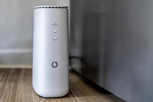 a white object is sitting on a wooden floor at Apartment - 3 Einzelbetten - Stellplatz - Netflix in Goch
