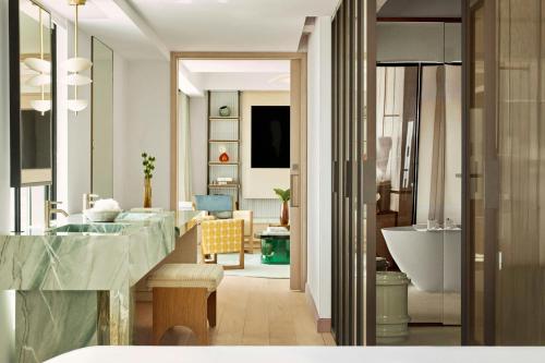 a bathroom with a sink and a bath tub at Hotel Arts Barcelona in Barcelona