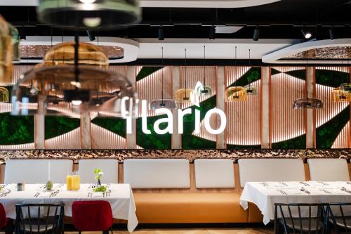 a restaurant with two tables and a sign that reads taroa at Wings Plaza in Kraków