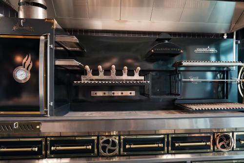 a large kitchen with a large stove top oven at Wings Plaza in Kraków