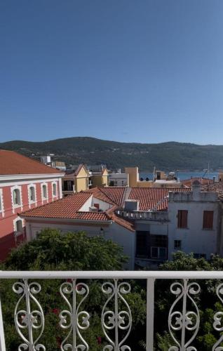 a view of a city from a balcony at Philoxenia Apartments in Samos