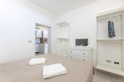 A bed or beds in a room at Villa Topazio