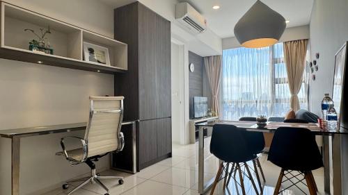 a kitchen with a table and chairs in a room at Panoramic KL View @Robertson Bukit Bintang 40f in Kuala Lumpur