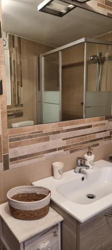 a bathroom with a sink and a mirror at Linda's house in Monforte dʼAlba