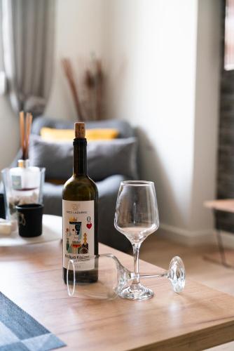 a bottle of wine and a glass on a table at Seaside Casa in Nafpaktos