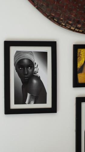 a black and white picture of a woman on a wall at Riad Al Manara in Essaouira