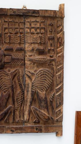 a wooden wall with a relief on it at Riad Al Manara in Essaouira