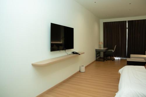 Puli Passo Hotel Casinoにあるテレビまたはエンターテインメントセンター