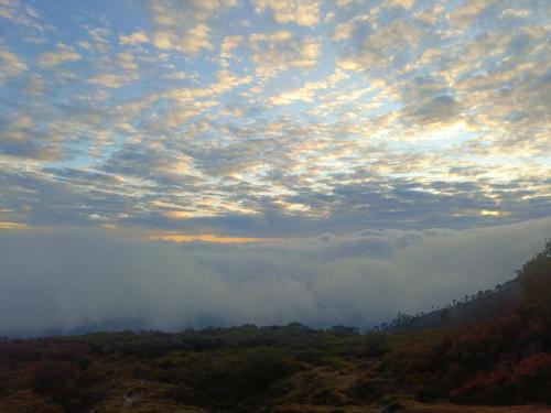 a view of a valley with clouds in the sky at Nio Homestay and Tour in Licin
