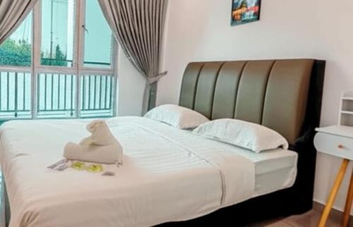 Ένα ή περισσότερα κρεβάτια σε δωμάτιο στο Galaxy Luxury Homestay