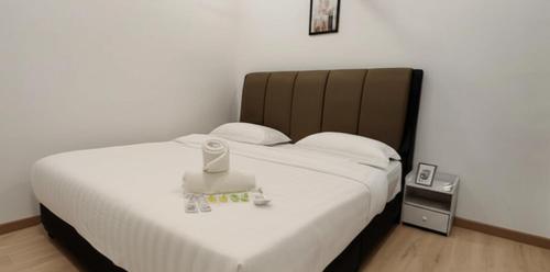 Ένα ή περισσότερα κρεβάτια σε δωμάτιο στο Galaxy Luxury Homestay