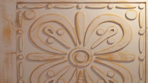 a painting of a flower on a wall at Riad Al Manara in Essaouira