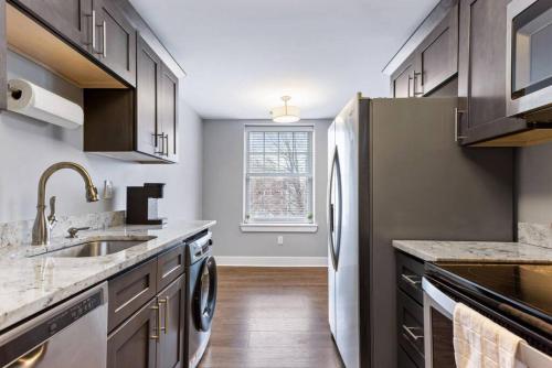 a kitchen with a sink and a refrigerator at Your Cozy One Bedroom Detriot in Detroit