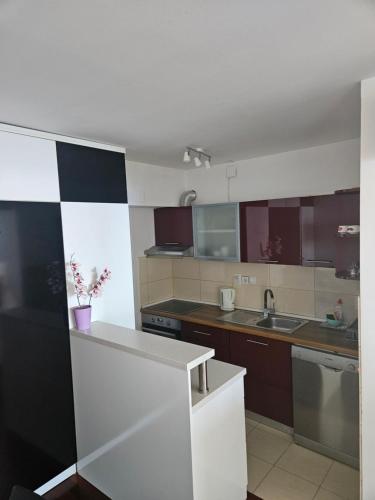 a kitchen with a sink and a counter top at Beach Villa Bozikovic in Podstrana