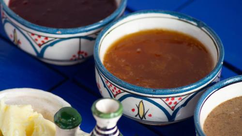 three cups of soup on a blue table at Riad Al Manara in Essaouira