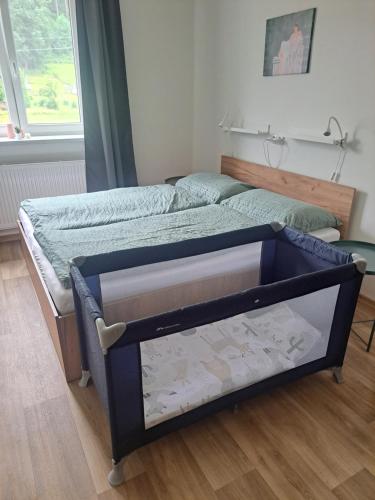 Postel nebo postele na pokoji v ubytování Apartmán Nerudova