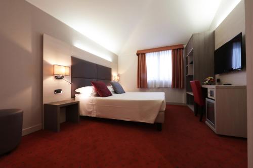 Posteľ alebo postele v izbe v ubytovaní Hotel Campion CityLife